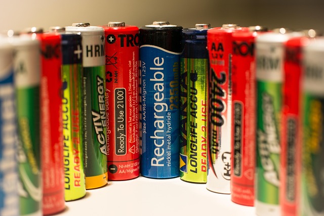 battery energy storage cabinets installed at a commercial facility with safety signage
